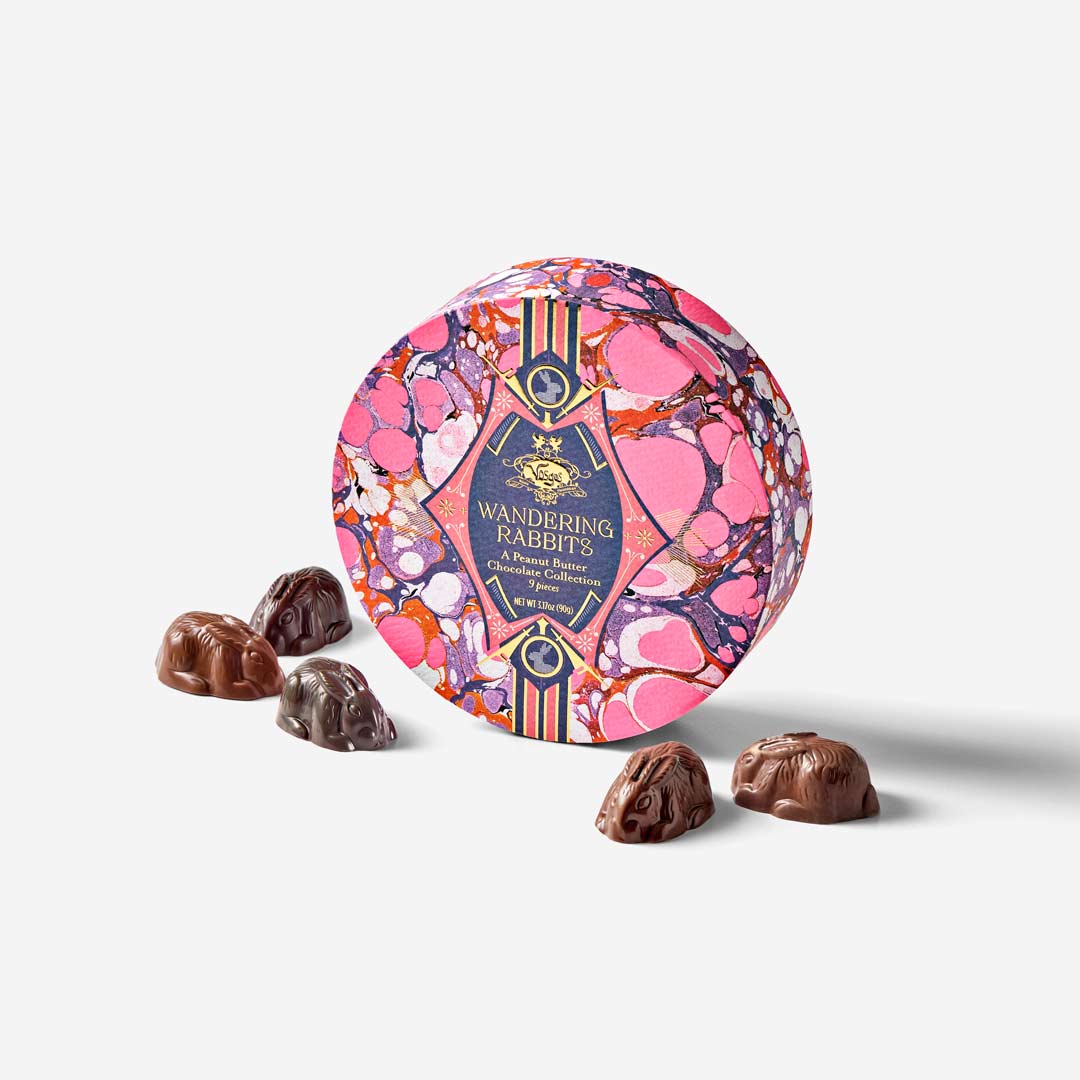 Decorative chocolate tin with 'Wandering Rabbit' branding on a white background