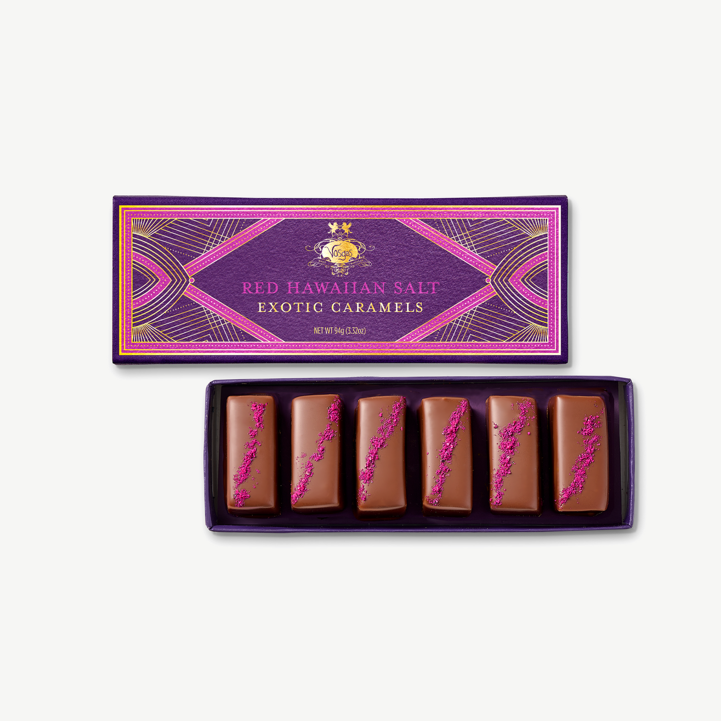 Purple Vosges box lid reading Red Hawaiian Salt Exotic Caramels with an open box of chocolates.