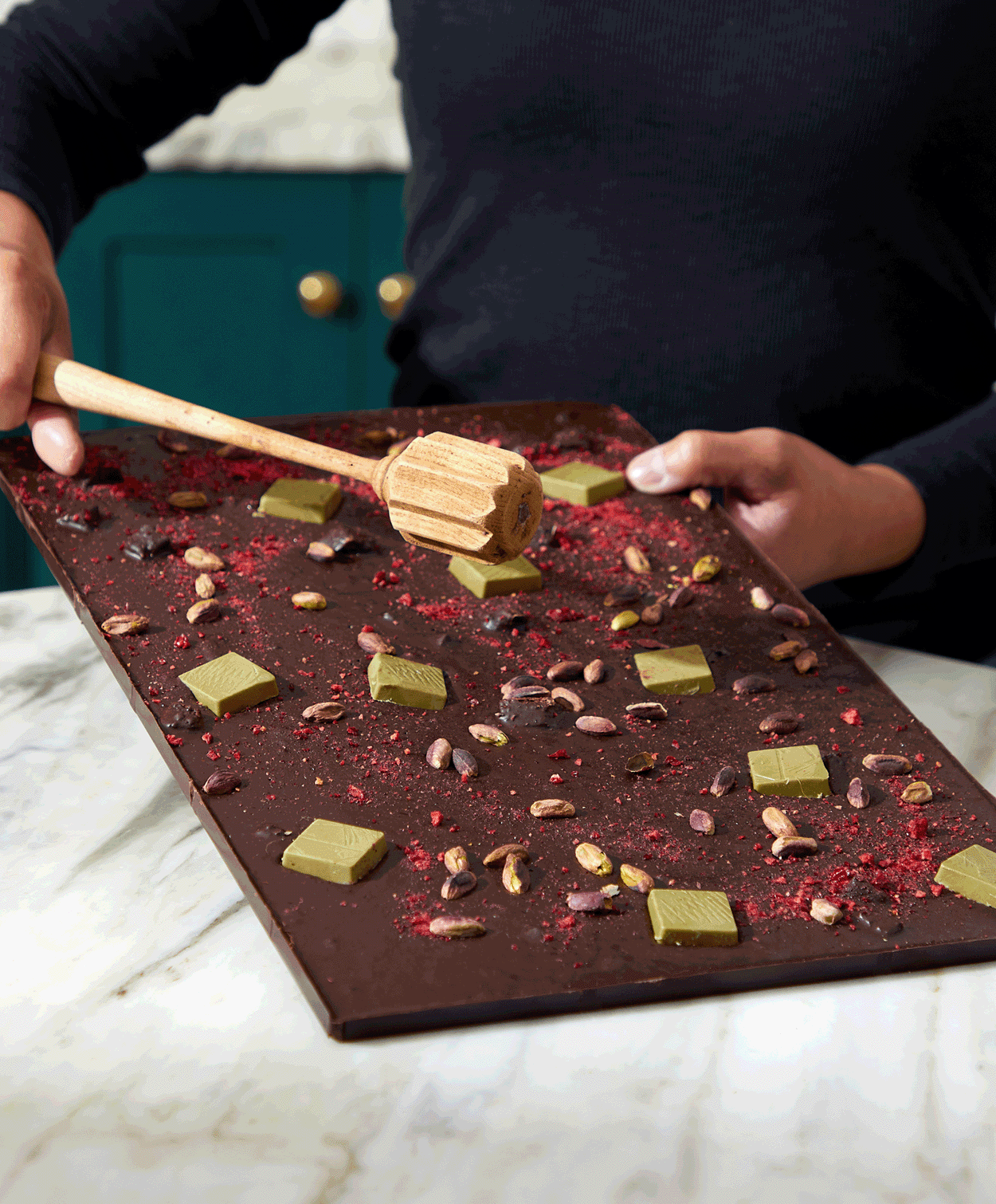 Video of Vosges Soiree Smash chocolate slab from different angles with upbeat music.