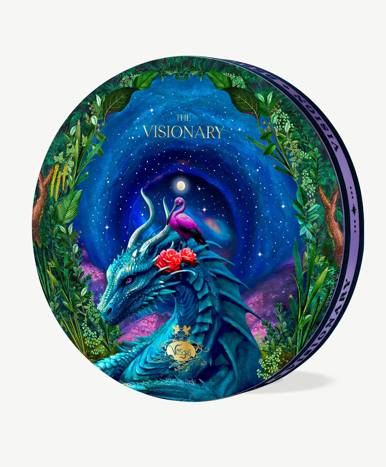 A Vosges chocolate box trimmed in purple velvet, adorned with a large blue dragon and pink egret bird surrounded by green leafy trees infront a swirling dark night sky, sits upright on a light grey background.