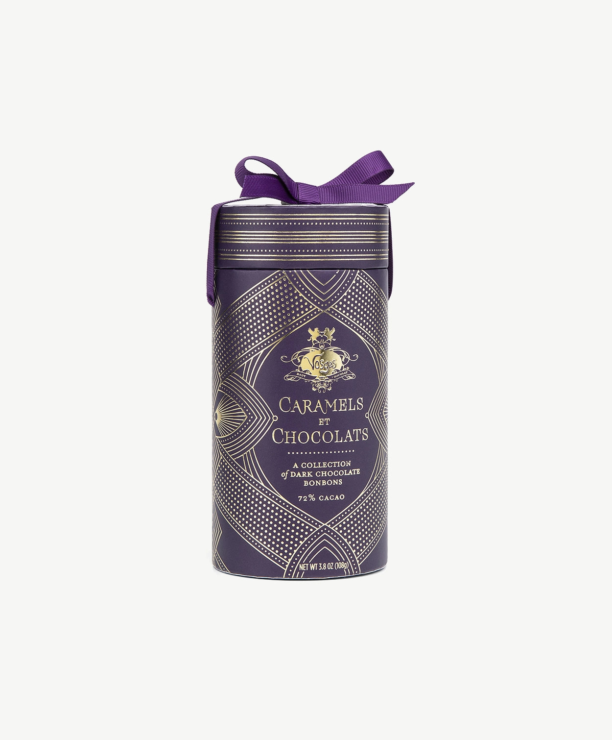 A purple tube embossed with gold foil reading, "Caramels et Chocolats" tied with a purple ribbon bow stands against a light grey background.