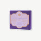 A purple Vosges Haut-Chocolat candy box reading, "Caramel Marshmallows" stands upright on a white background.