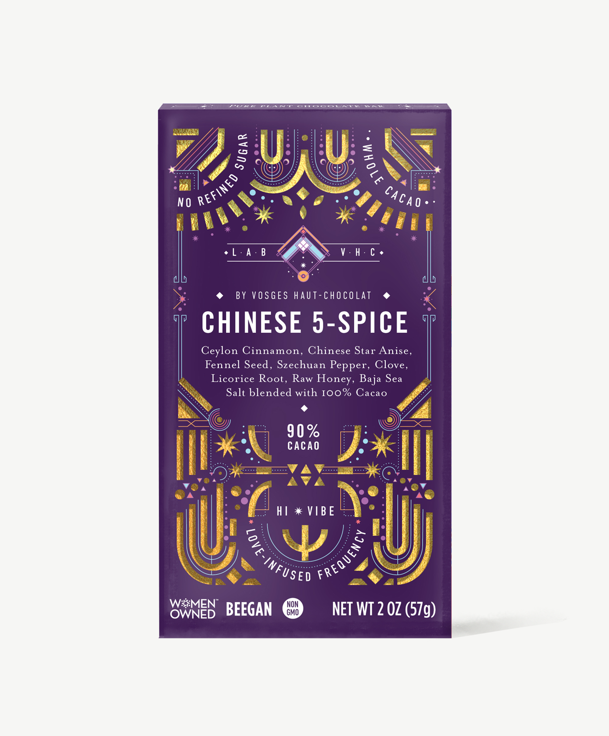 Vosges Chinese 5 spice Pure Plant chocolate bar stands upright in a dark purple box decorated with golden suns and moons on a grey background.