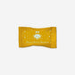 Vosges Dubai Style Bonbon chocolate bar in a yellow wrapper with white logo