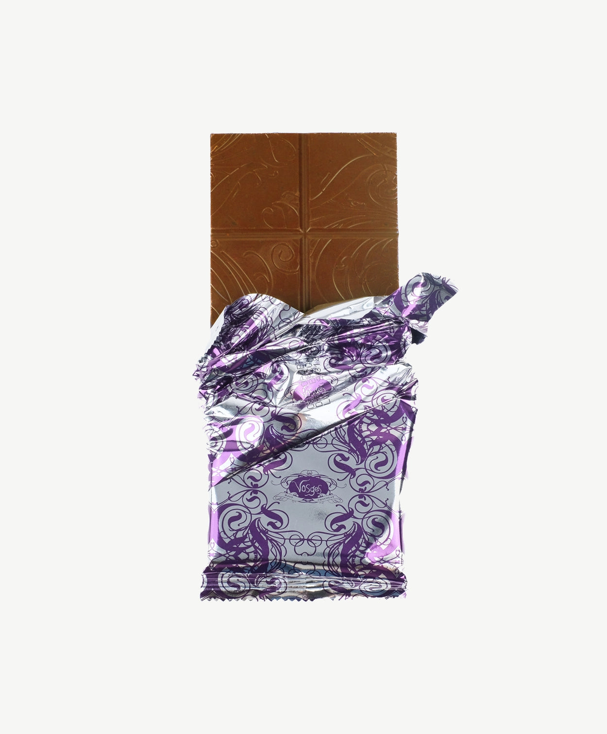 An opened Vosges Chedder and Apple Chocolate bar in a silver wrapper stands upright on a white background.