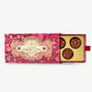 An extravagant pink and gold box is slid open to reveal champagne dessert cups adorned with dried dragon fruit