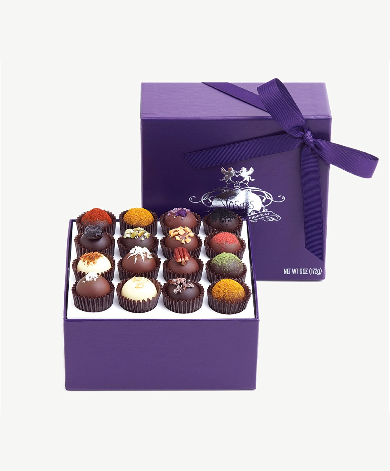 Open box of Vosges Haut-Chocolat Exotic Chocolate Truffles dusted with colorful toppings.