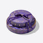 Enchanted Magic Chocolate Tower purple gift box with gold pattern tied with a purple ribbon