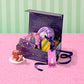 Decorative gift box with pastries on a pink surface and striped green background