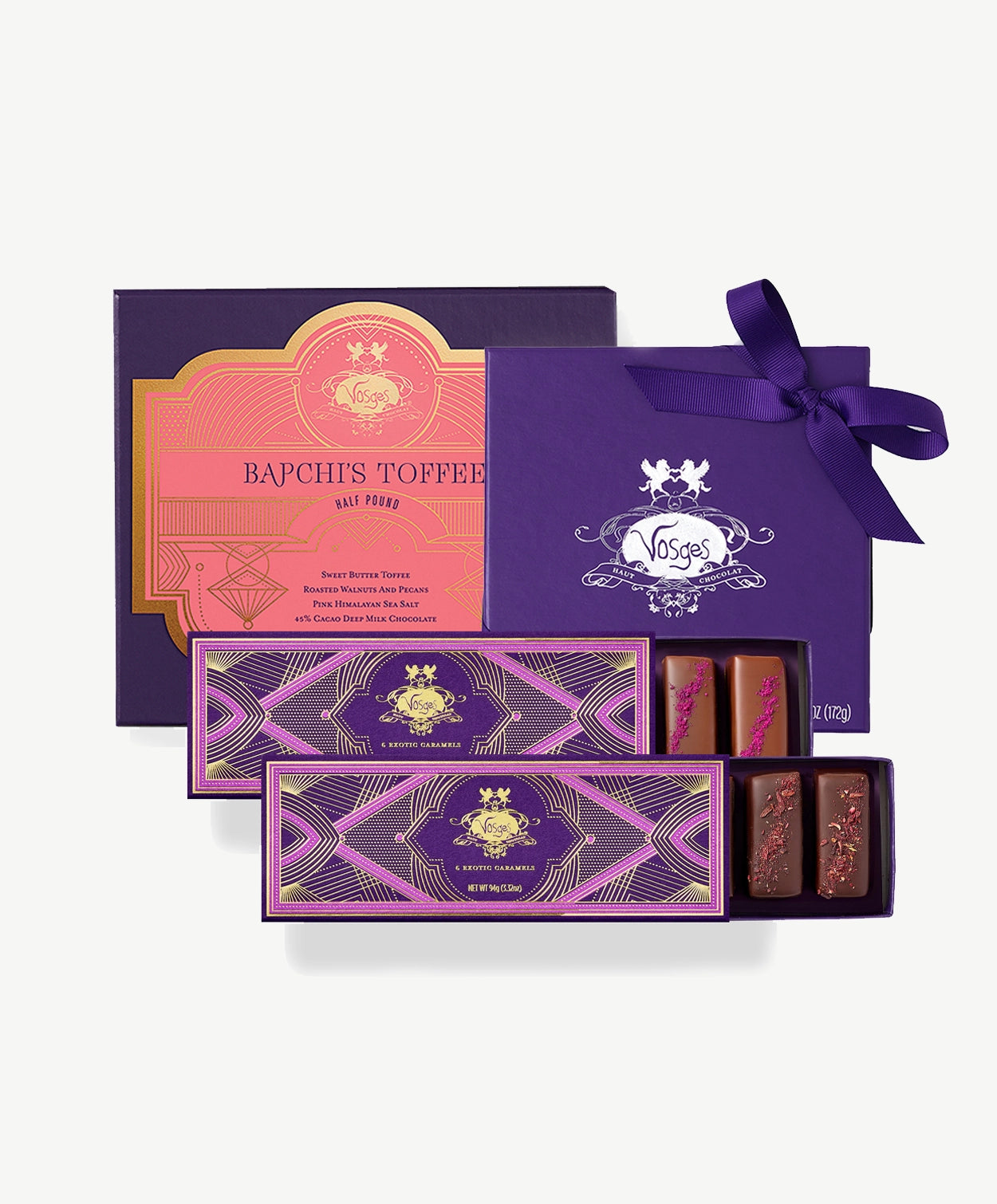 Vosges caramels, exotic truffle collection and Bapchi's toffee, included in the Grande Gift Tower sit on a white background.