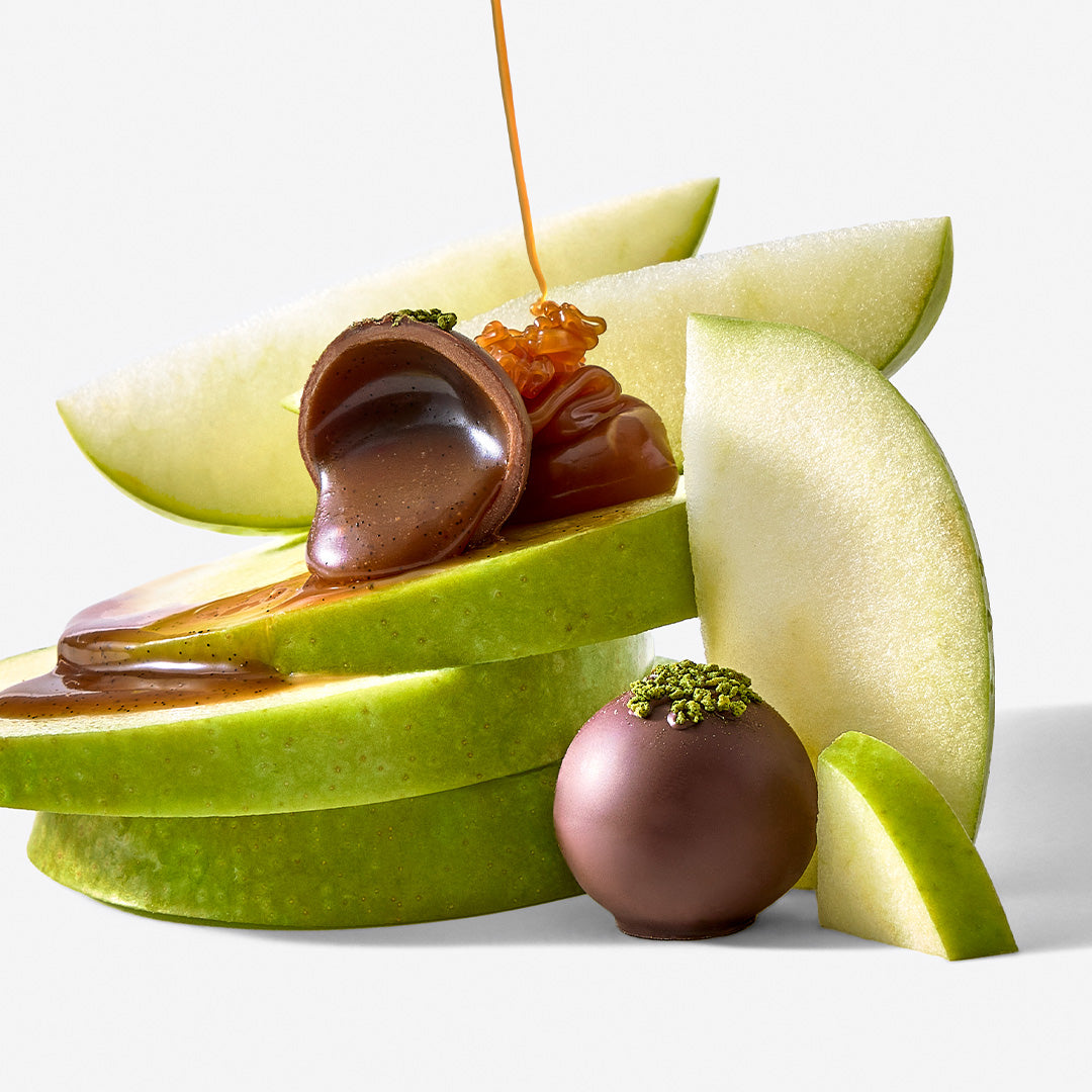 Cider Caramel Truffles plated on green apple slices with caramel drizzle