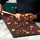 Video of Vosges Soiree Smash chocolate slab from different angles with upbeat music.