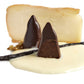 Close up of a white chocolate piece with dark chocolate shards from The Iconic Collection 16 pieces.