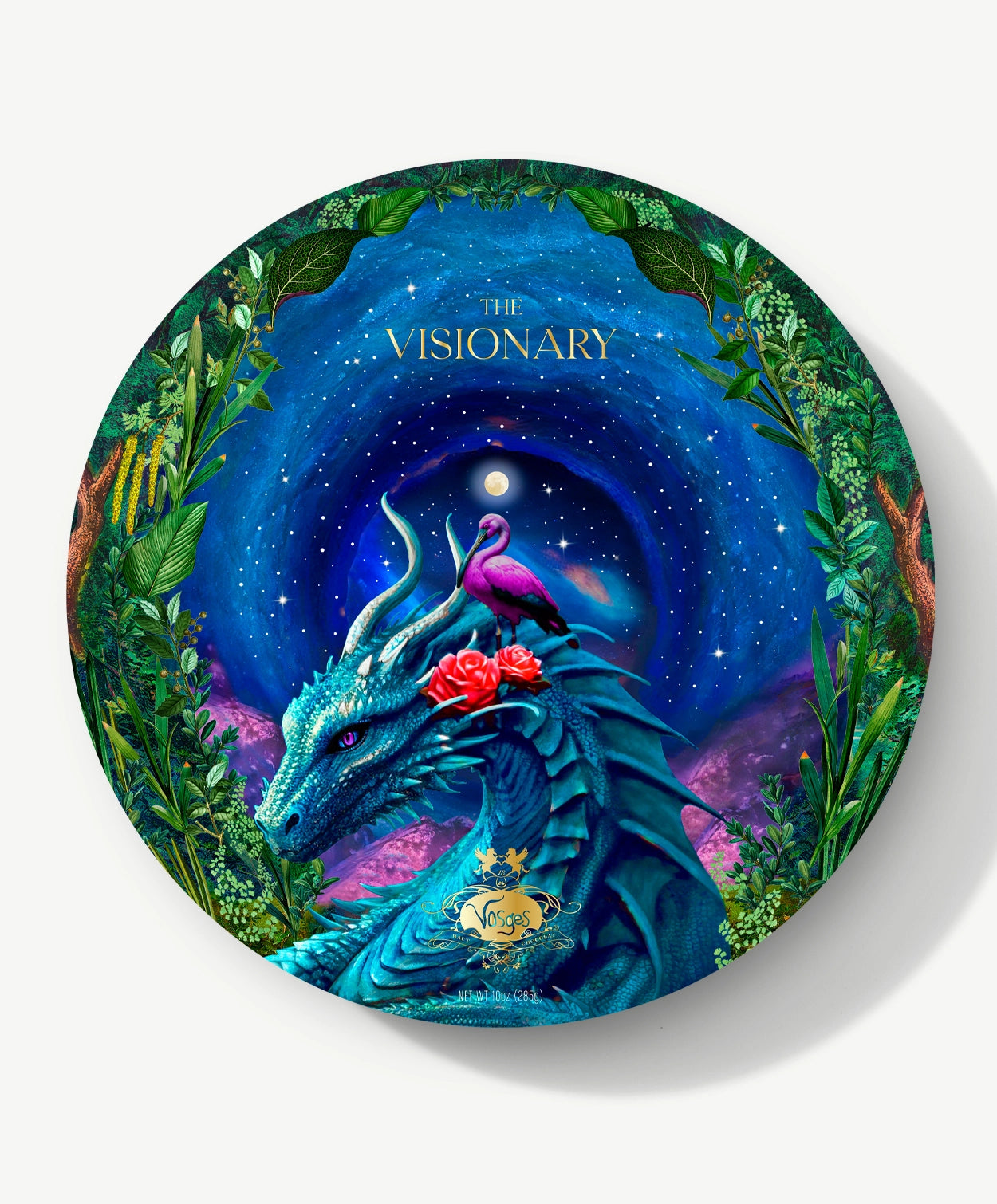 A circular Vosges candy box sits adorned with a wise blue dragon and a pink egret with roses sit in a leafy forest infront a swirling night sky, on a light grey background.