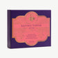 Purple Vosges chocolate box with a pink label reading, "Bapchi's Toffee" stands upright on a light grey background.