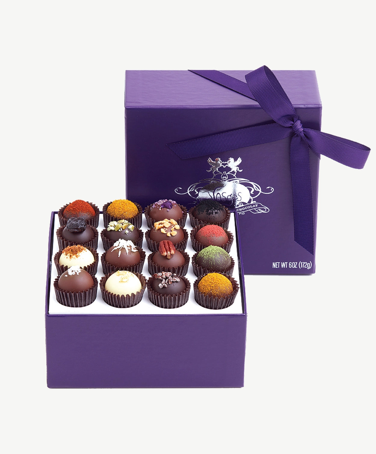 Open box of Vosges Haut-Chocolat Exotic Chocolate Truffles dusted with colorful toppings.