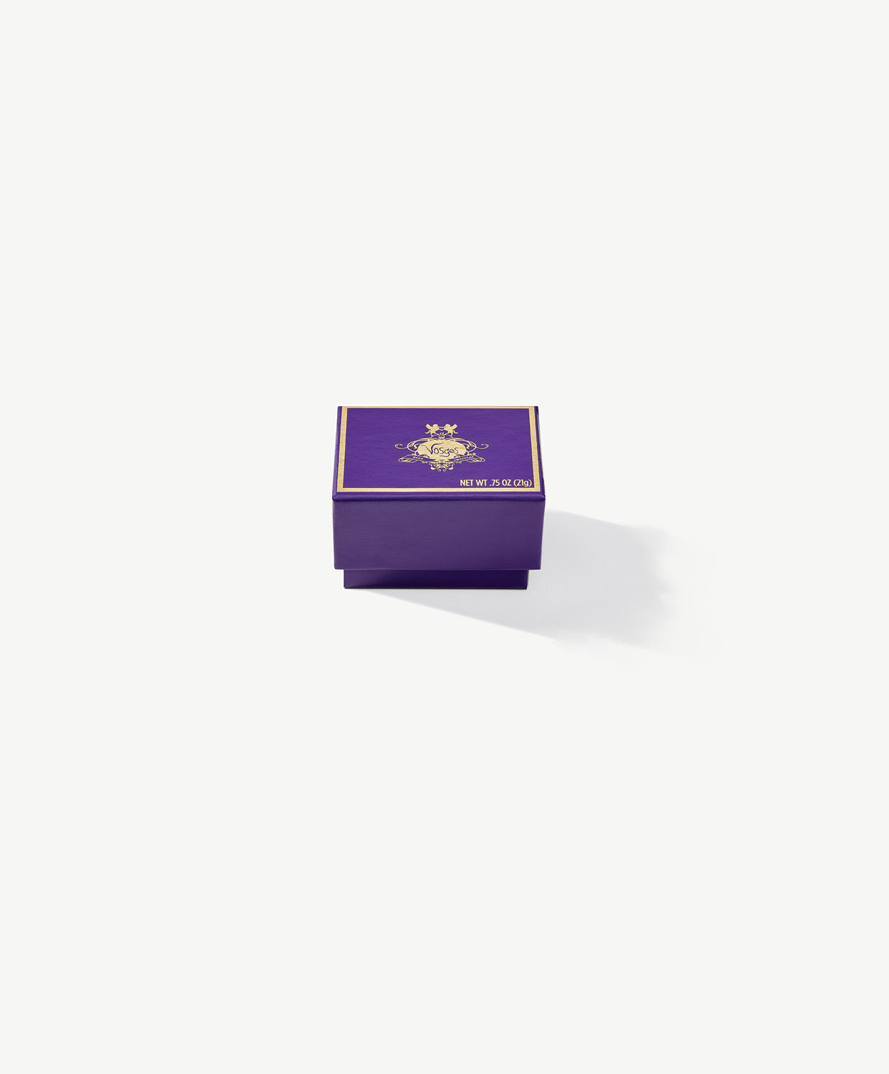 A small purple Vosges Chocolate box embossed with gold foil on a grey background.