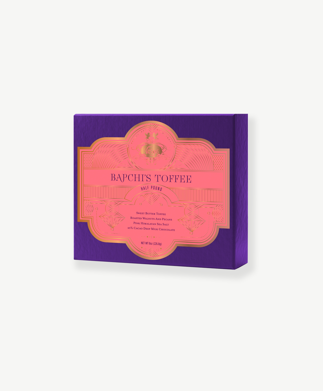 Purple Vosges chocolate box with a pink label reading, "Bapchi's Toffee" stands upright on a white background.