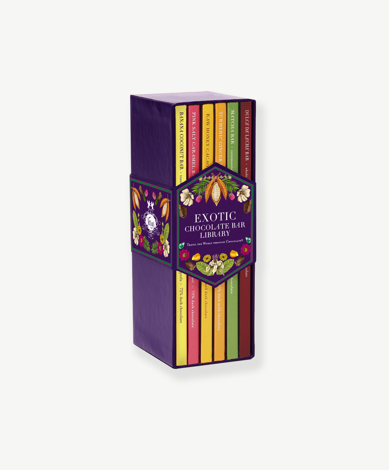 A tall purple box containing six colorful chocolate bars, bound by a purple sleeve reading, "Exotic Chocolate Bar Library" stands upright on a grey background.