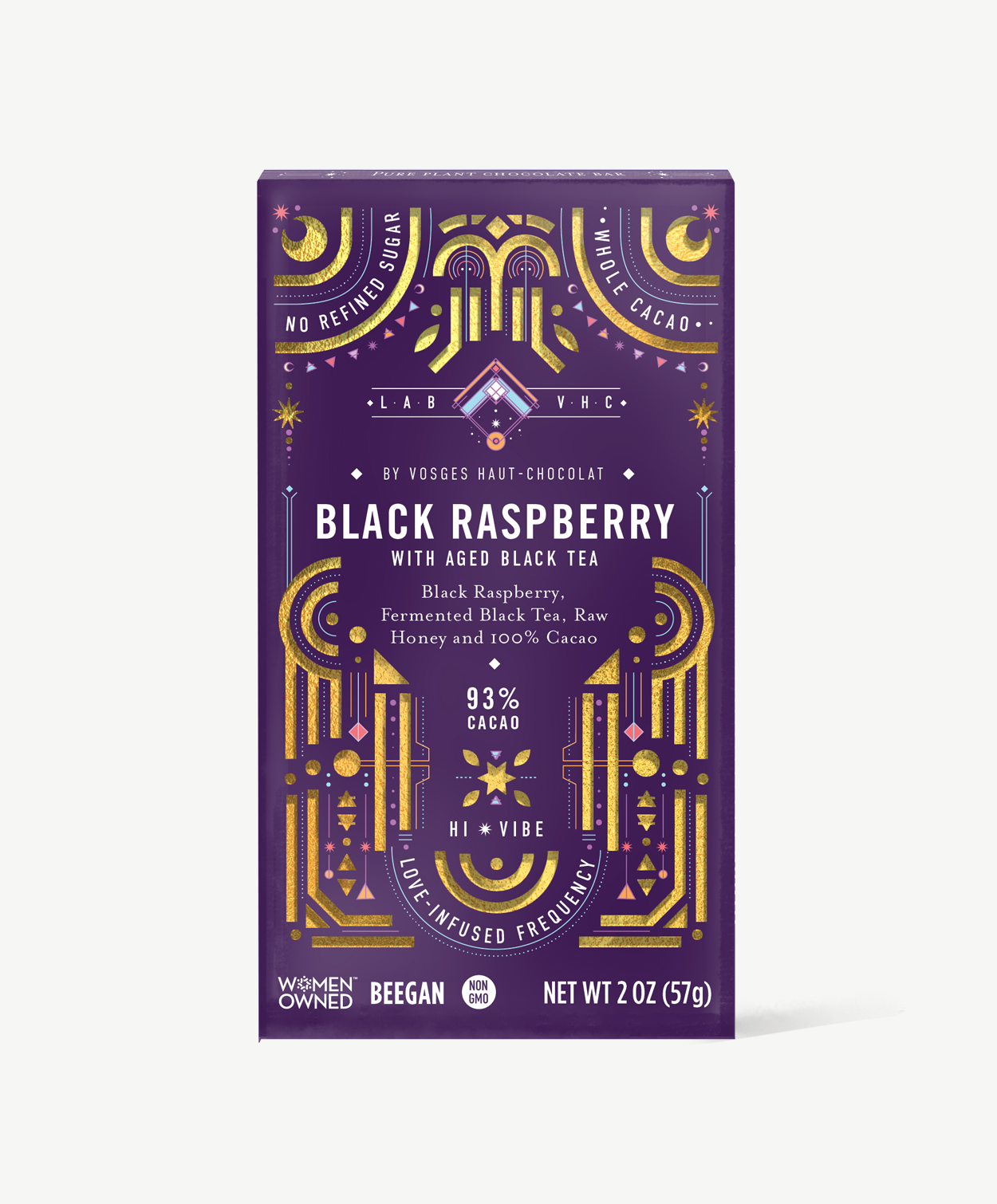 Vosges Black Raspberry Pure Plant chocolate bar stands upright in a dark purple box  decorated with golden suns and moons on a grey background. 