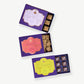 Three open boxes of Vosges Chocolate showing toffee, peanut butter bonbons and caramel marshmallows.