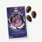 Chocolate Peanut Butter Skulls sit beside a purple and blue box decorated with the silhouettes of birds reading, "Trick or Treat" lay on a light grey background.