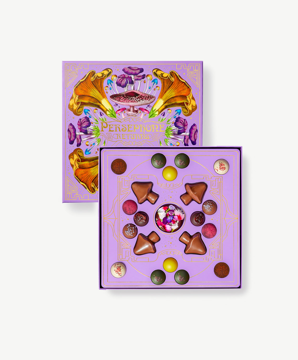 Pale Purple candy box decorated emblazoned in colorful, psychadelic mushroom art sits open displaying a multi-colored collection of chocolate mushroom truffles.  